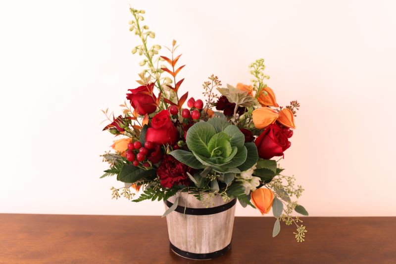 Mulled Wine classic bouquet with rich ruby and orange blooms by Studley Flower Gardens
