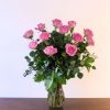one dozen pink roses lush