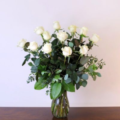 one dozen white roses lush