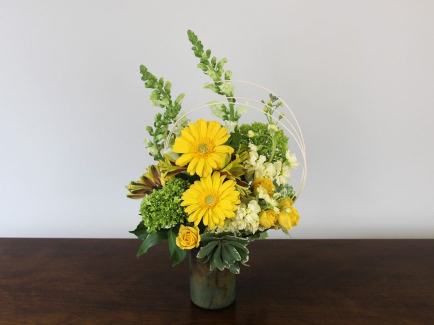 Gemini bouquet with bright yellow and green flowers by Studley Flower Gardens